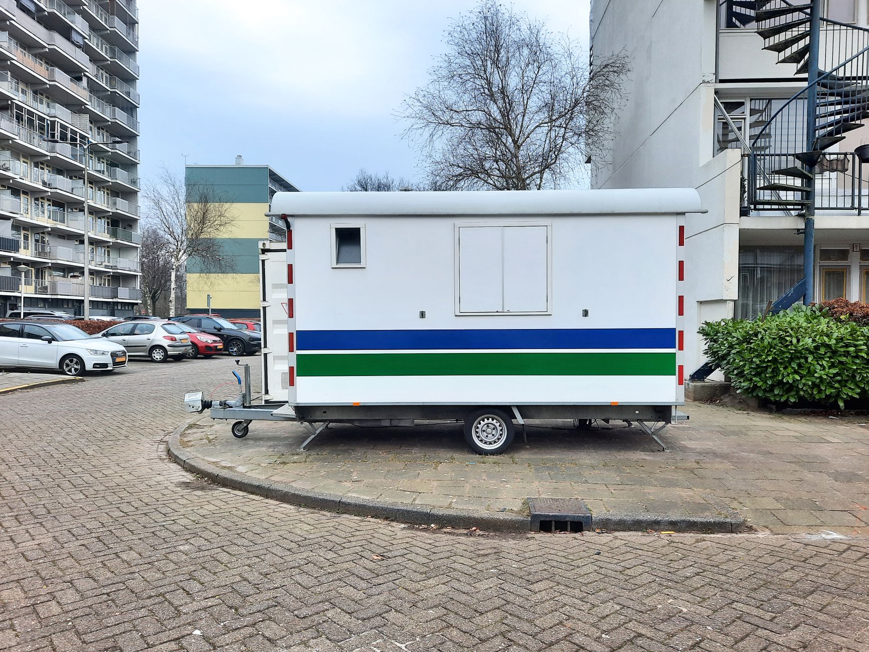 5x8 utility trailer, mesh sides — view 1