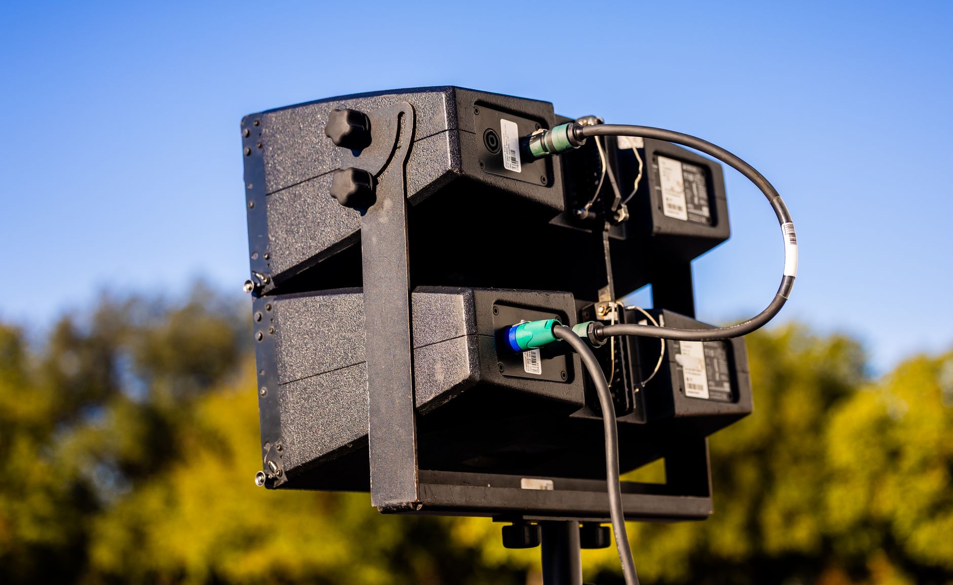 QSC K12.2 pair with stands and mixer — view 1